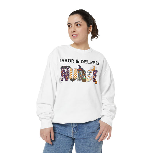 White crewneck sweatshirt on a model, personalized Halloween Nurse design with nurse specialty text above a 'NURSE' wordmark styled with a pumpkin, witch hat, ghost, and bat